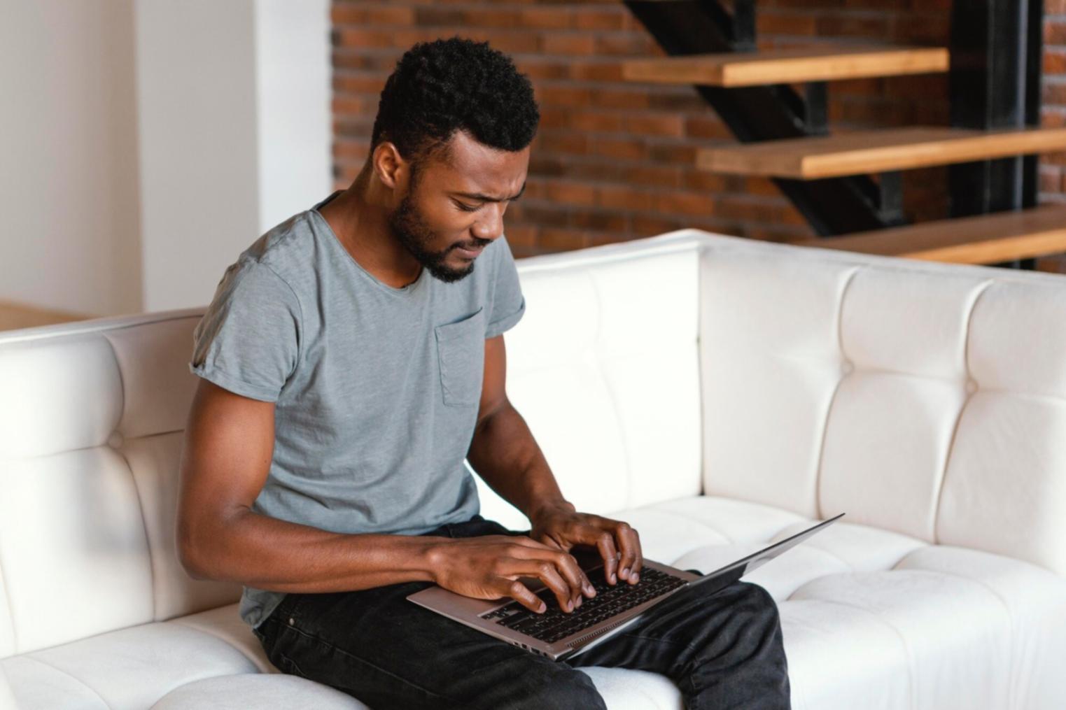 Person reviewing financial documents and income statements at organized desk workspace